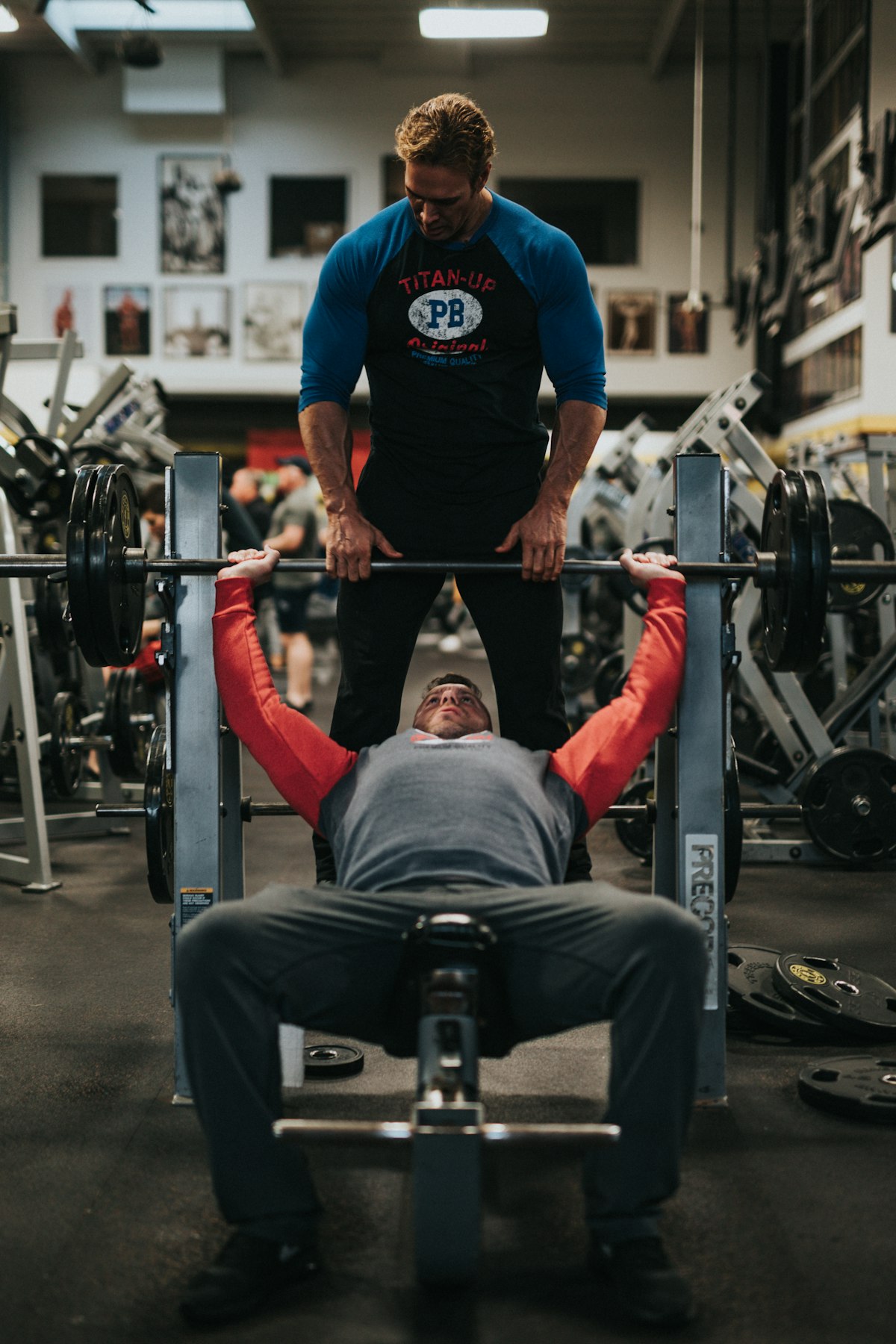 Coach spotting a client on the bench press