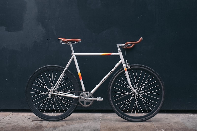 Vintage road bicycle against a dark wall