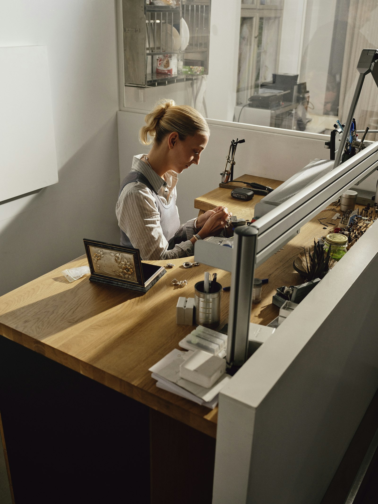 Woman working with hand tools at a workshop bench