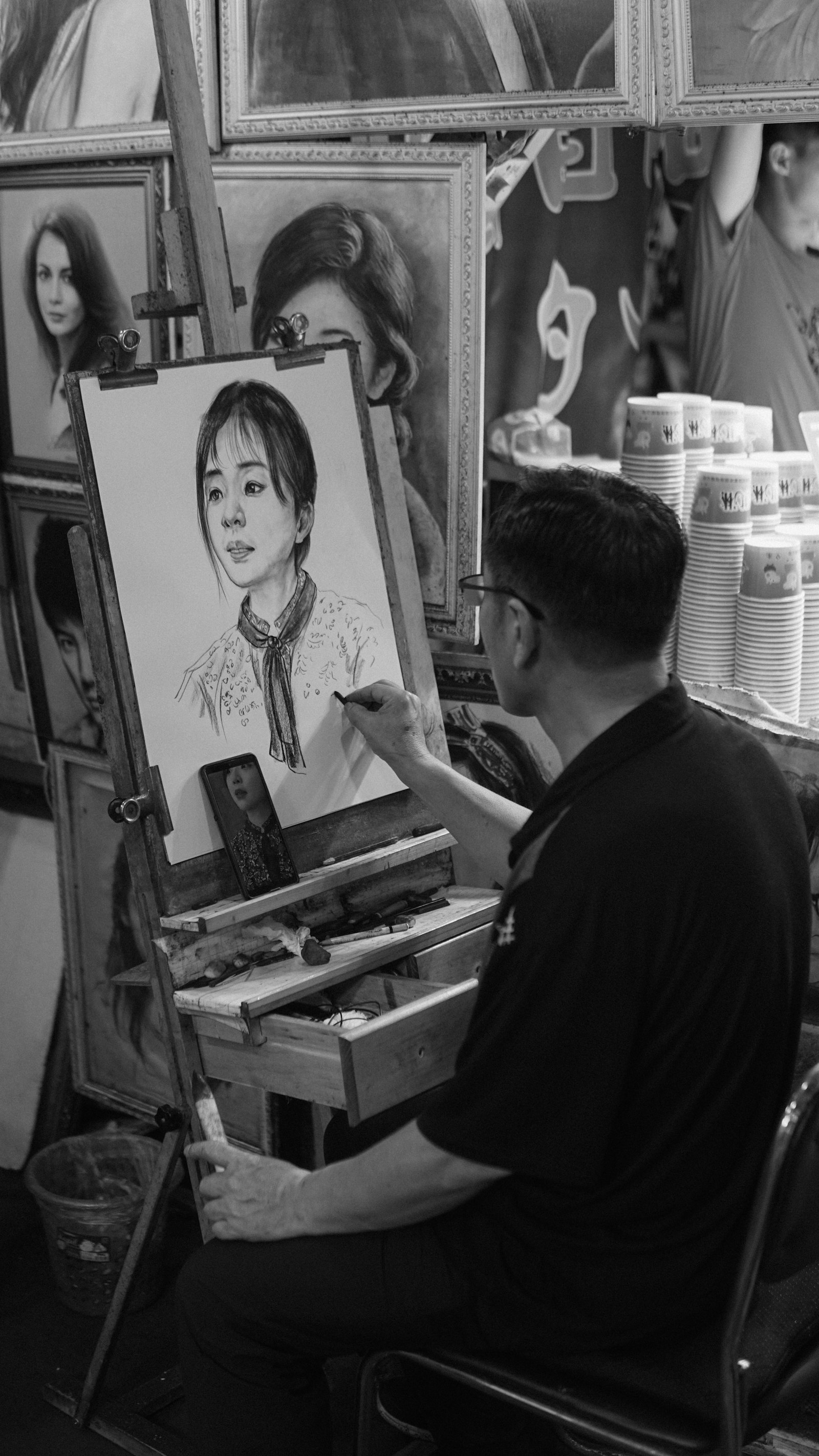 Man at work on a piece in his studio