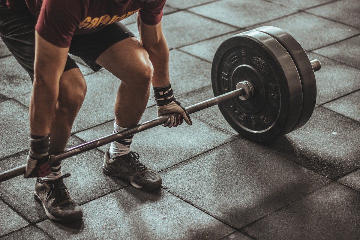 Lifter mid-deadlift with chalked hands