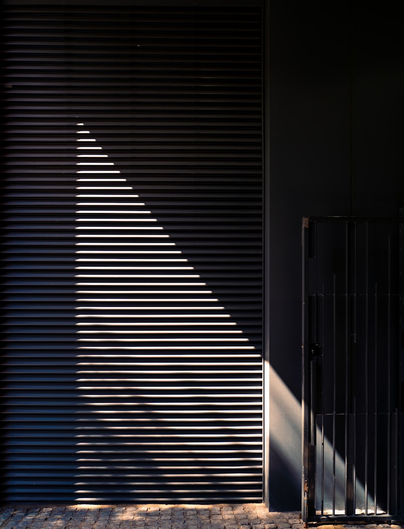 Afternoon light falling across window blinds