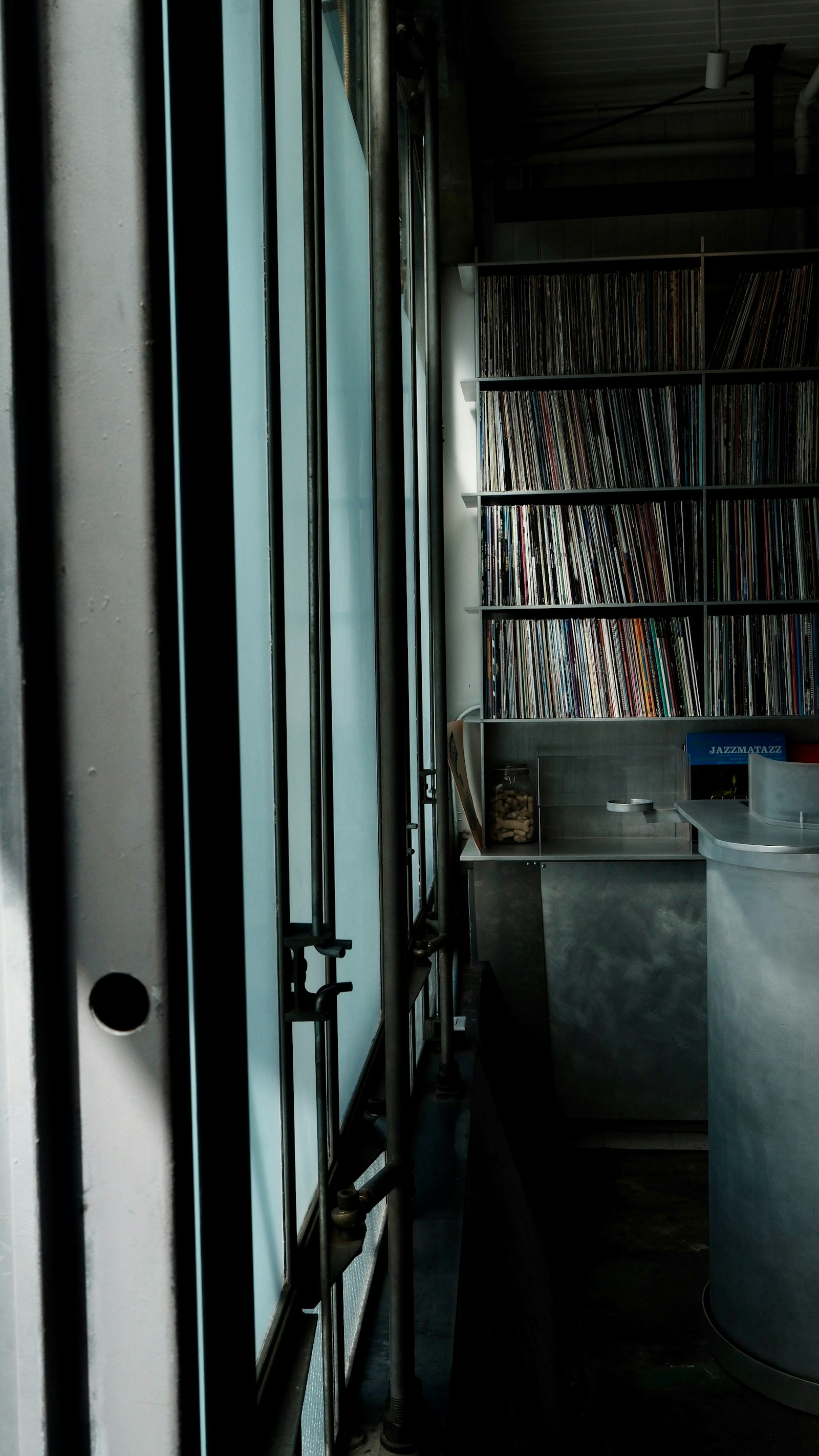 Shelves of records in a dimly lit room